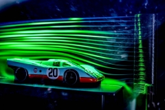 A model wind tunnel displays the aerodynamics of the Porsche 917. A model wind tunnel displays the aerodynamics of the Porsche 917.