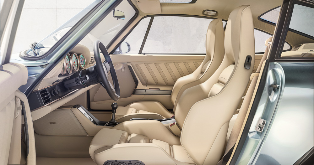 Bespoke interior specified with a focus on refined, luxury grand touring. Presented in Malibu Sand with electrically adjustable, heated touring seats, six-speed manual transmission, inductive phone charging, air-conditioning and Black Forest wood accents.
