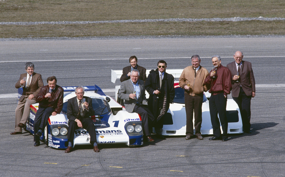 Porsche anniversary 1992 in Weissach: 10 years 956/962 on 9.4.1992. From left to right Fritz Spingler, Valentin Schäffer, Peter Falk, Gerd Schmid, Helmut Schmid (behind), Hans Mezger, Norbert Singer, Horst Reitter, Eugen Kolb. Porsche-anniversary-1992-in-Weissach-10-years-956962-on-9.4.1992